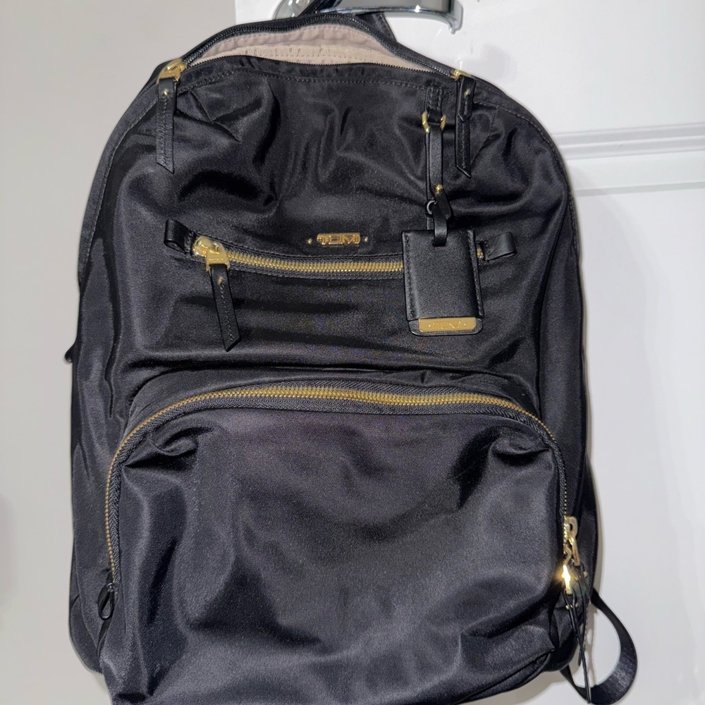TUMI Voyageur Black Backpack with Gold Accents- excellent used condition.
